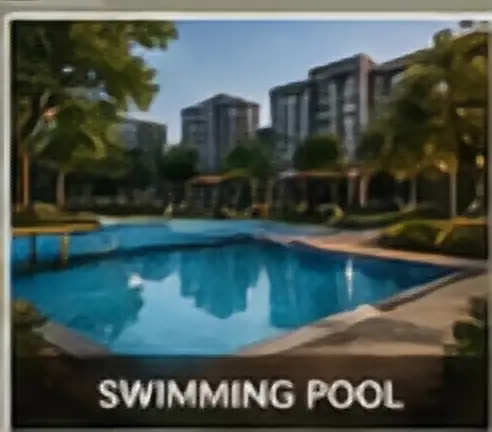 Outdoor swimming pool beside the clubhouse at Embassy Chapparkallu